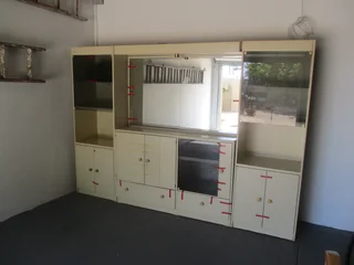 2Wall unit with built in bar, lots of storage space, sliding drawers and mirrors. Great value .