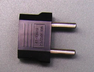 Adapter to convert a 2-pin flat USA plug to a 2-pin rounded European/South African 2 pin plug. New.