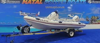 UNIQUE 540 ON TRAILER 115 HP JOHNSON