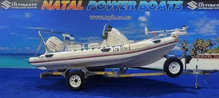 UNIQUE 540 ON TRAILER 115 HP JOHNSON