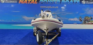 UNIQUE 540 ON TRAILER 115 HP JOHNSON