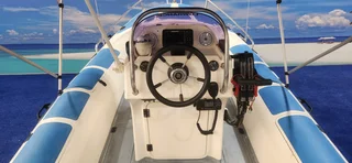 UNIQUE 575 RTB ON TRAILER 2 X 60 HP MERCURY TRIM AND TILTS FINANCE ARRANGED