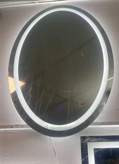 Oval frameless mirror with LED light