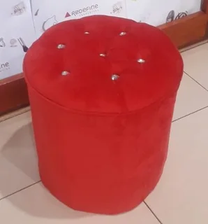 New red velvet ottoman stools with buttons