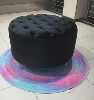 Round velvet ottoman with buttons