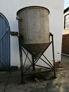 Large steel feed/grain silo on stand