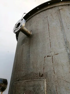 Large steel feed/grain silo on stand