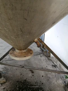 Large steel feed/grain silo on stand