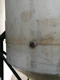 Large steel feed/grain silo on stand