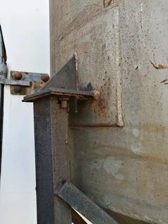 Large steel feed/grain silo on stand