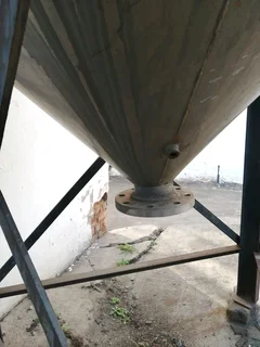 Large steel feed/grain silo on stand