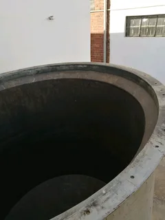 Large steel feed/grain silo on stand