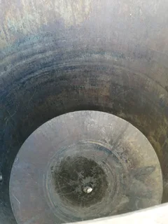 Large steel feed/grain silo on stand