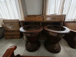 Complete 8-seater dining room suite & bedroom suite. Both with dressers and mirrors.