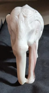 Elephant figurine intricately carved with decorative pattern