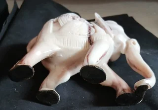 Elephant figurine intricately carved with decorative pattern