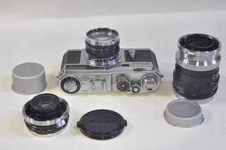 Nikon SP rangefinder film camera with 3 lenses, case etc