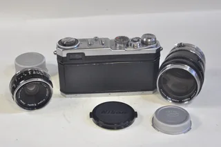 Nikon SP rangefinder film camera with 3 lenses, case etc