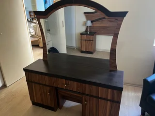 Bedroom suite with headboard and dressing, table and stool