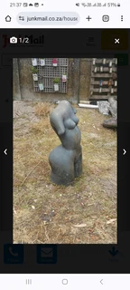 Garden Statue made of Stone very heavy but great conversational piece can be put inside and outside