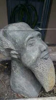 Statue of Tata an old man - Stone