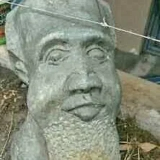 Statue of Tata an old man - Stone