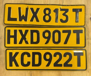 Vintage Black And Yellow Metal Number Plates