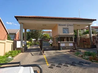 2 Bed, 1.5 Bath duplex townhouse in Mount Grace, 1 lockup garage plus 1 covered parking.