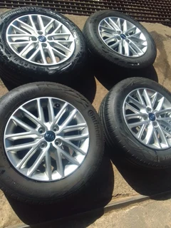 A brand new set of 15inch Kia Rio mags and tyres