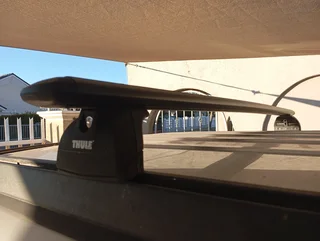 Thule roof rack and fixing brackets for sale. Excellent condition. R3500