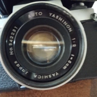 Yashica Penta Camera with 135mm and 50mm lens, leather bag and electronic Flash