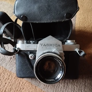 Yashica Penta Camera with 135mm and 50mm lens, leather bag and electronic Flash
