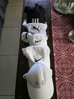 Assorted golf caps for sale