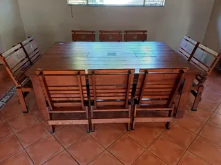 10 seater wooden table and chairs