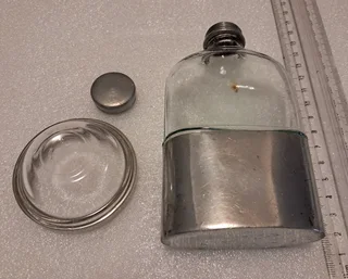 Possibly silver plate - unmarked - hip flask and tiny bowl R500 for the pair.