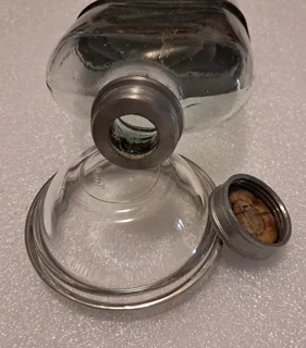 Possibly silver plate - unmarked - hip flask and tiny bowl R500 for the pair.