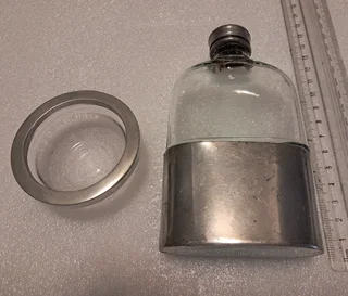 Possibly silver plate - unmarked - hip flask and tiny bowl R500 for the pair.