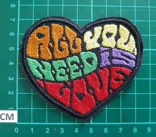 Embroidered all you need is love fabric patch