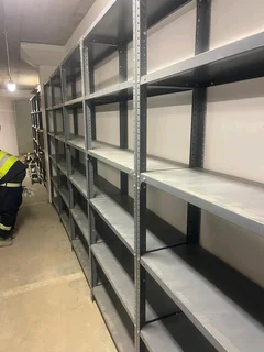Industrial Dexion shelving for sale disassembled. Comes in 6 shelf and 5 shelf.