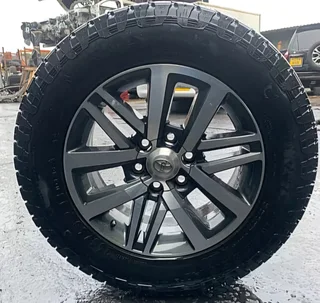 Hilux and Fortuner wheel with new AT tyre, bargain. Wheel alone R4 650 at agents. Both for R3 800
