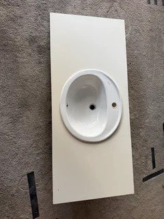 Bathroom vanity top with basin