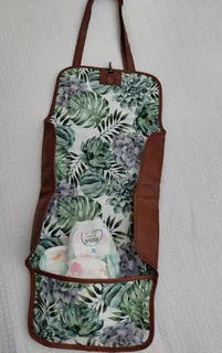 Leather nappies bag and fold out nappy change mat.