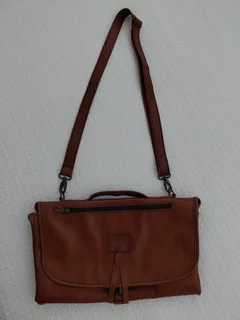 Leather nappies bag and fold out nappy change mat.