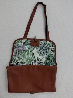 Leather nappies bag and fold out nappy change mat.