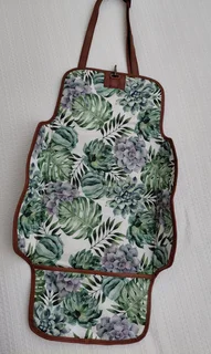 Leather nappies bag and fold out nappy change mat.