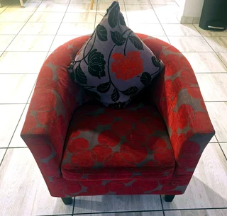 Orange symmetric tub chair with matching scatter cushion