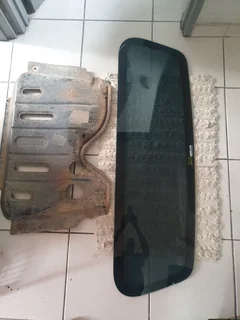 Nissan NP200 splash cover plate.Back window.