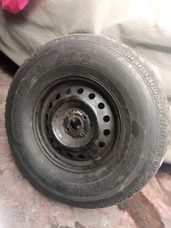Semi off road tyre with rim