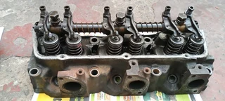 Ford V6 heads. Complete with rockers and valves