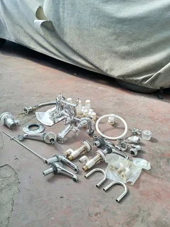 Britannia shower mixer, Victoria style bath taps and various other taps and parts. New